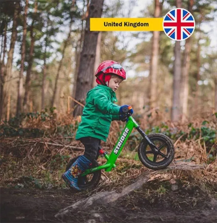 Child riding Strider balance bike proper seat height